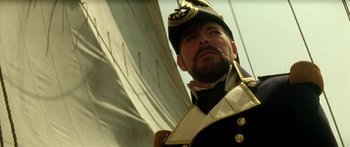 Movie still from “Star Trek: Generations” (1994), directed by David Carson – A person wearing a uniform; Close Up shot, Low angle