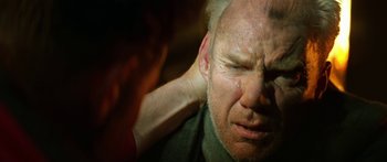 Movie still from “Star Trek: Generations” (1994), directed by David Carson – A person touching a man's face with his hand; Close Up shot, Over the shoulder angle