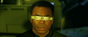 Movie still from “Star Trek: Generations” (1994), directed by David Carson – A man with a yellow strip on his face; Close Up shot, Low angle
