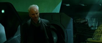 Movie still from “Star Trek: Generations” (1994), directed by David Carson – An older man with white hair standing in front of an object; Medium shot, Low angle
