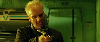 Movie still from “Star Trek: Generations” (1994), directed by David Carson – A man holding a gun in his hand; Close Up shot, Low angle