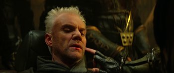 Movie still from “Star Trek: Generations” (1994), directed by David Carson – A man with white hair is getting his hair cut; Close Up shot, Low angle
