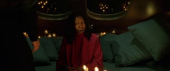 Movie still from “Star Trek: Generations” (1994), directed by David Carson – A woman in a red robe holding a candle; Medium shot, Over the shoulder angle