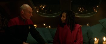 Movie still from “Star Trek: Generations” (1994), directed by David Carson – A man and a woman talking to each other in a room; Medium shot, Over the shoulder angle