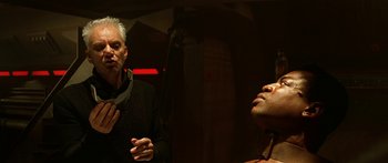 Movie still from “Star Trek: Generations” (1994), directed by David Carson – A man and a woman are talking in a dark room; Close Up shot, Over the shoulder angle