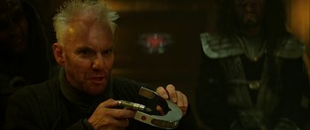Movie still from “Star Trek: Generations” (1994), directed by David Carson – A man holding a pair of wrenches in his hands; Close Up shot, Over the shoulder angle