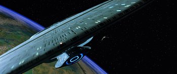 Movie still from “Star Trek: Generations” (1994), directed by David Carson – A space ship in the middle of the night sky; Extreme Wide shot, Low angle