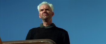 Movie still from “Star Trek: Generations” (1994), directed by David Carson – A man with white hair and a black sweater; Close Up shot, Low angle