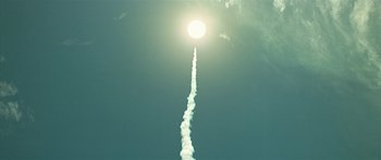 Movie still from “Star Trek: Generations” (1994), directed by David Carson – A jet flying through the air with a bright sun behind it; Extreme Wide shot, Low angle