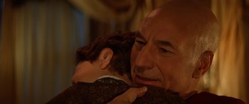 Movie still from “Star Trek: Generations” (1994), directed by David Carson – An older man and a younger man are hugging; Close Up shot, Over the shoulder angle