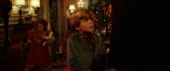 Movie still from “Star Trek: Generations” (1994), directed by David Carson – A young boy in a green jacket looking up at a christmas tree; Close Up shot, Over the shoulder angle