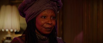 Movie still from “Star Trek: Generations” (1994), directed by David Carson – An older woman wearing a purple head covering; Close Up shot, Over the shoulder angle