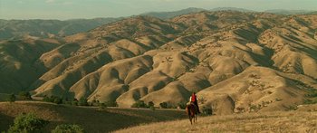 Movie still from “Star Trek: Generations” (1994), directed by David Carson – A person on a horse in a field; Extreme Wide shot, High angle