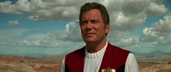 Movie still from “Star Trek: Generations” (1994), directed by David Carson – A person wearing a red and white jacket; Close Up shot, Over the shoulder angle
