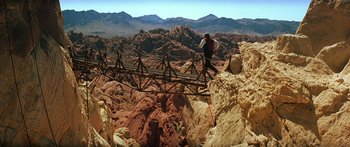 Movie still from “Star Trek: Generations” (1994), directed by David Carson – A man walking across a bridge over a canyon; Extreme Wide shot, High angle