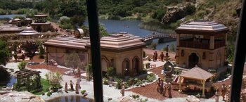 Movie still from “Star Trek: Insurrection” (1998), directed by Jonathan Frakes – A group of people standing in front of a building; Extreme Wide shot, High angle