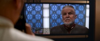 Movie still from “Star Trek: Insurrection” (1998), directed by Jonathan Frakes – An older man looking in a mirror at a church; Close Up shot, Over the shoulder angle