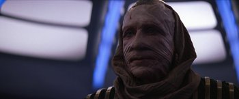 Movie still from “Star Trek: Insurrection” (1998), directed by Jonathan Frakes – A person wearing a mask; Close Up shot, Over the shoulder angle