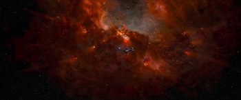 Movie still from “Star Trek: Insurrection” (1998), directed by Jonathan Frakes – An airplane flying through the sky in a nebula; Extreme Wide shot, Overhead angle