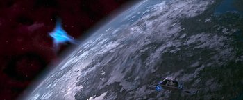 Movie still from “Star Trek: Insurrection” (1998), directed by Jonathan Frakes – An image of an airplane flying over the earth; Extreme Wide shot, Overhead angle