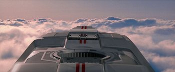 Movie still from “Star Trek: Insurrection” (1998), directed by Jonathan Frakes – View of the top portion of a spaceship; Extreme Wide shot, Overhead angle