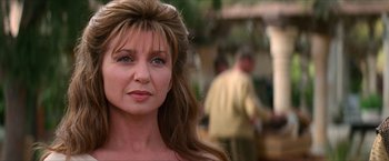 Movie still from “Star Trek: Insurrection” (1998), directed by Jonathan Frakes – A person with long brown hair; Close Up shot, Over the shoulder angle