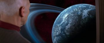 Movie still from “Star Trek: Insurrection” (1998), directed by Jonathan Frakes – An image of an image of the earth in space; Extreme Wide shot, Low angle