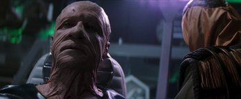 Movie still from “Star Trek: Insurrection” (1998), directed by Jonathan Frakes – A person's face in a chair; Close Up shot, Low angle