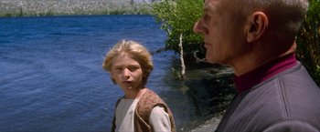 Movie still from “Star Trek: Insurrection” (1998), directed by Jonathan Frakes – A man and a woman standing next to a body of water; Close Up shot, Over the shoulder angle