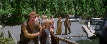 Movie still from “Star Trek: Insurrection” (1998), directed by Jonathan Frakes – A group of people standing in a forest; Medium shot, Over the shoulder angle