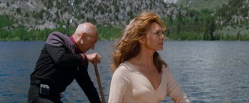 Movie still from “Star Trek: Insurrection” (1998), directed by Jonathan Frakes – A man and a woman are rowing a boat in the water; Medium shot, Over the shoulder angle