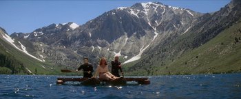 Movie still from “Star Trek: Insurrection” (1998), directed by Jonathan Frakes – A group of people sitting on top of a raft in a body of water; Extreme Wide shot, High angle