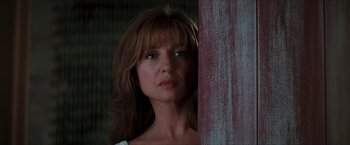 Movie still from “Star Trek: Insurrection” (1998), directed by Jonathan Frakes – A person standing next to a pole; Close Up shot, Low angle