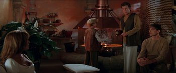 Movie still from “Star Trek: Insurrection” (1998), directed by Jonathan Frakes – A man and a woman standing next to an oven; Medium shot, Low angle