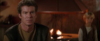 Movie still from “Star Trek: Insurrection” (1998), directed by Jonathan Frakes – A man sitting in front of a fire place; Close Up shot, Over the shoulder angle