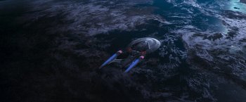 Movie still from “Star Trek: Insurrection” (1998), directed by Jonathan Frakes – An image of a person in the water; Extreme Wide shot, Overhead angle