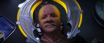 Movie still from “Star Trek: Insurrection” (1998), directed by Jonathan Frakes – An image of an alien in a space suit; Close Up shot, High angle
