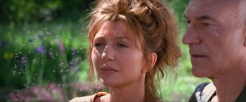 Movie still from “Star Trek: Insurrection” (1998), directed by Jonathan Frakes – A person wearing a brown shirt; Close Up shot, Over the shoulder angle