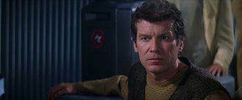 Movie still from “Star Trek: Insurrection” (1998), directed by Jonathan Frakes – A person wearing a jacket; Close Up shot, Over the shoulder angle