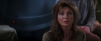 Movie still from “Star Trek: Insurrection” (1998), directed by Jonathan Frakes – A person with long brown hair; Close Up shot, Over the shoulder angle
