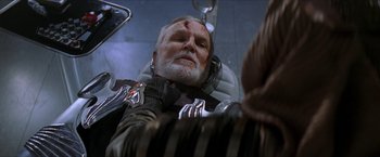 Movie still from “Star Trek: Insurrection” (1998), directed by Jonathan Frakes – An old man with a bandaged head sitting in a chair; Close Up shot, Over the shoulder angle