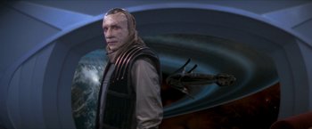 Movie still from “Star Trek: Insurrection” (1998), directed by Jonathan Frakes – An image of a man in a space suit in front of a space ship; Medium shot, Over the shoulder angle