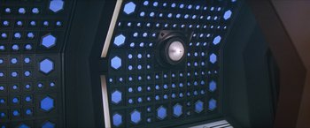 Movie still from “Star Trek: Insurrection” (1998), directed by Jonathan Frakes – View of a light fixture with blue lights on it; Extreme Wide shot, Overhead angle