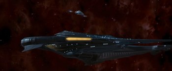 Movie still from “Star Trek: Insurrection” (1998), directed by Jonathan Frakes – An image of a space ship in the night sky; Extreme Wide shot, Low angle