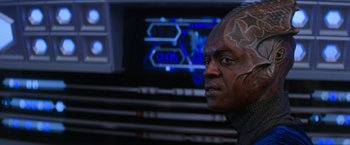 Movie still from “Star Trek: Insurrection” (1998), directed by Jonathan Frakes – A person with a face tattoo; Close Up shot, Over the shoulder angle