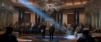 Movie still from “Star Trek: Nemesis” (2002), directed by Stuart Baird – Two men standing in front of an eagle statue; Wide shot, High angle