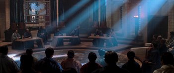 Movie still from “Star Trek: Nemesis” (2002), directed by Stuart Baird – A group of people sitting on top of benches in a room; Extreme Wide shot, High angle