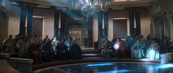 Movie still from “Star Trek: Nemesis” (2002), directed by Stuart Baird – A group of people sitting in a room; Extreme Wide shot, High angle