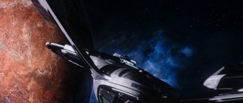 Movie still from “Star Trek: Nemesis” (2002), directed by Stuart Baird – A view of a space ship from the ground up; Extreme Wide shot, Overhead angle