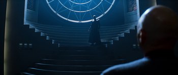 Movie still from “Star Trek: Nemesis” (2002), directed by Stuart Baird – A man walking down a set of stairs; Wide shot, Low angle